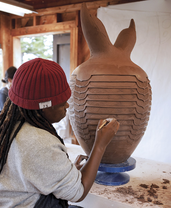 2 Madoda Fani, instructor of Masibumbe (Soul Shaping into Clay), working on a vessel in the clay studio.