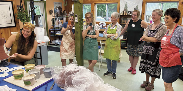 8 Lakyn Bowman and participants during the 2023 Mono-printing on Clay workshop at Blackberry Hill Art Center.