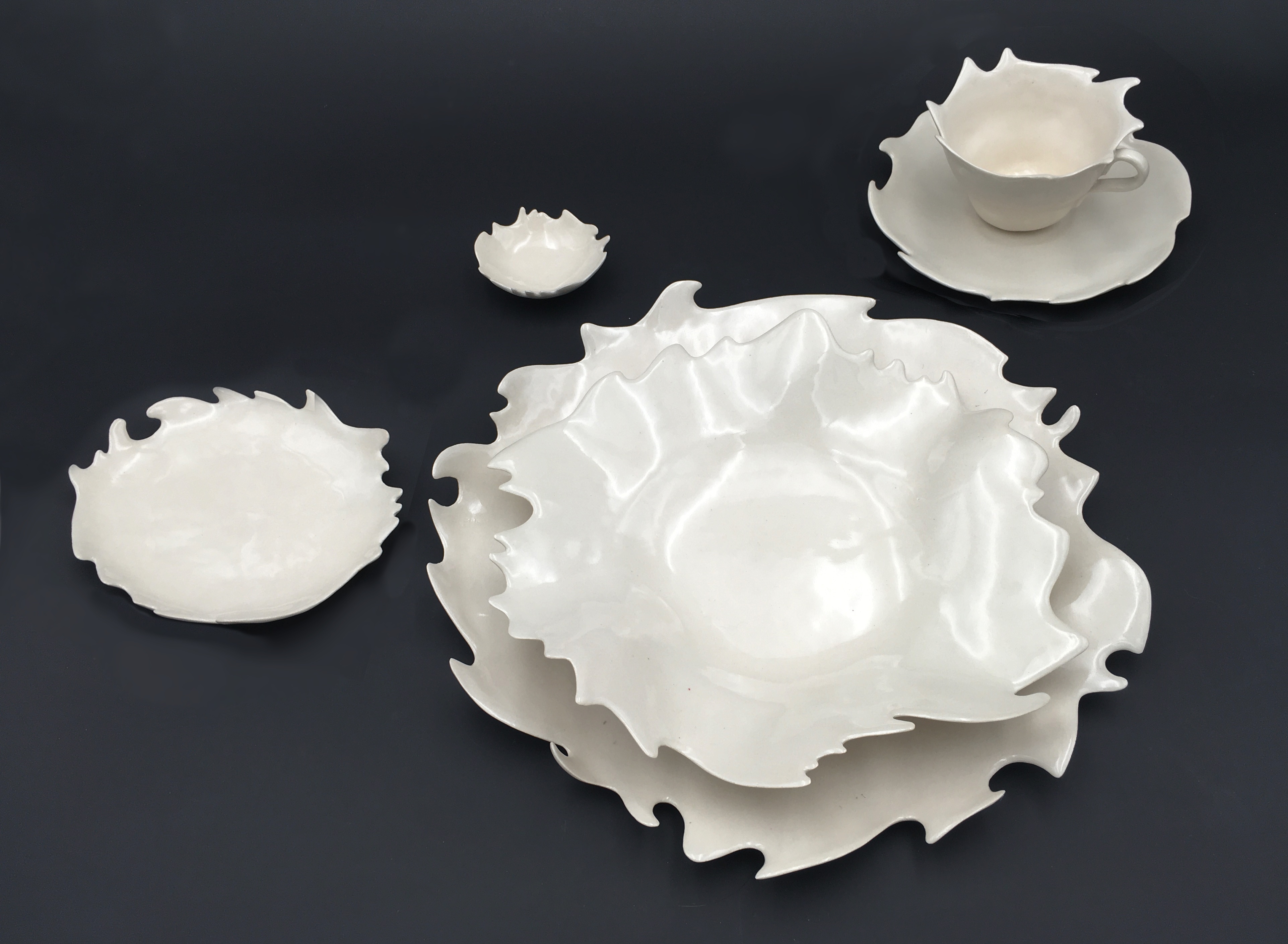 Maria Manhattan’s splashware set, porcelain, clear glaze, fired to cone 5, 2020. 