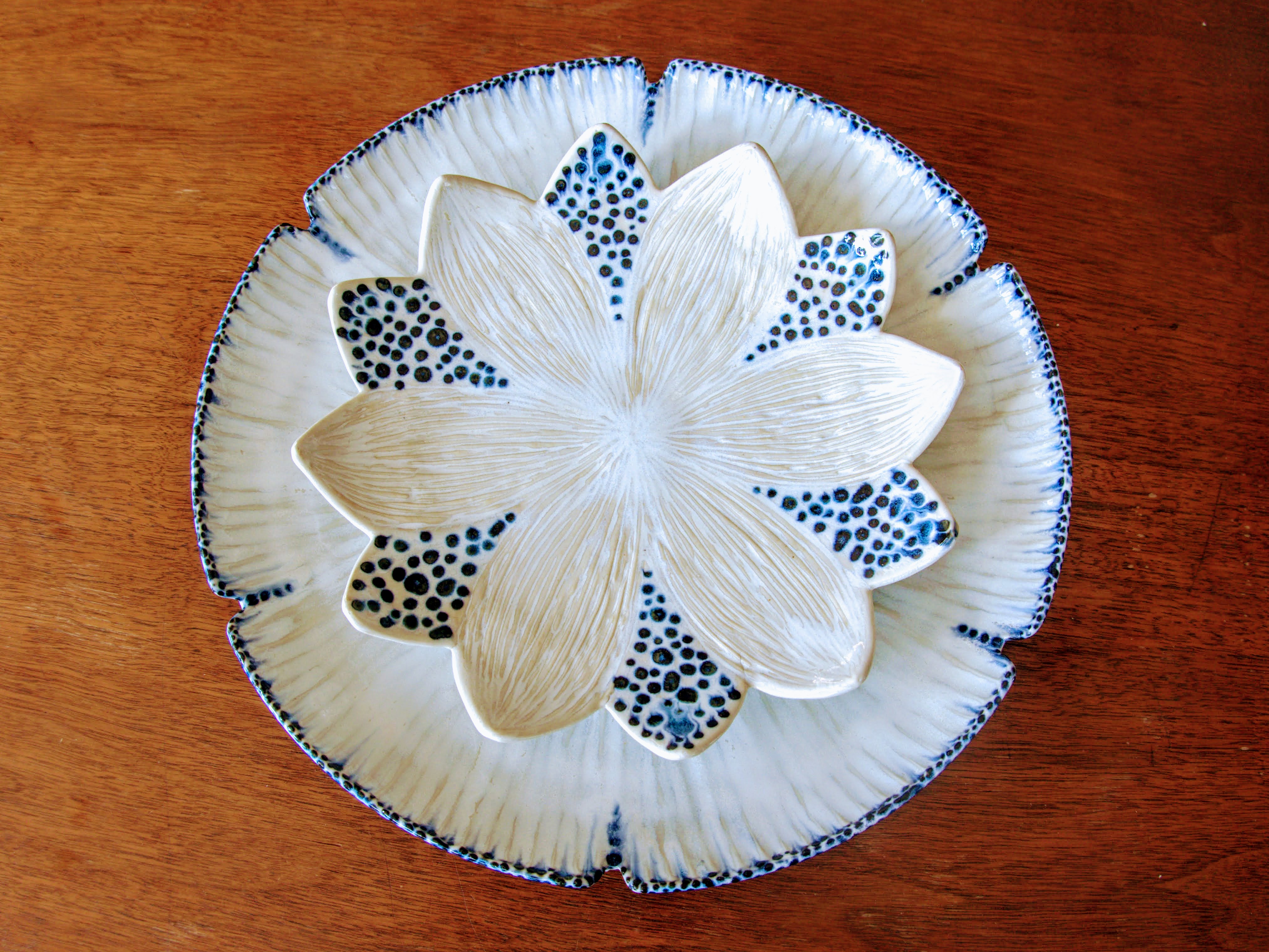 Tini Pinto’s dinner plates, 11 in. (28 cm) in diameter, wheel-thrown porcelain, fired to cone 6 in an electric kiln.
