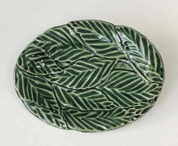 Suzanne Shield-Polk’s small leaf tray, 6 in. (15 cm) in length, stoneware, oribe glaze, fired to cone 6, 2020.